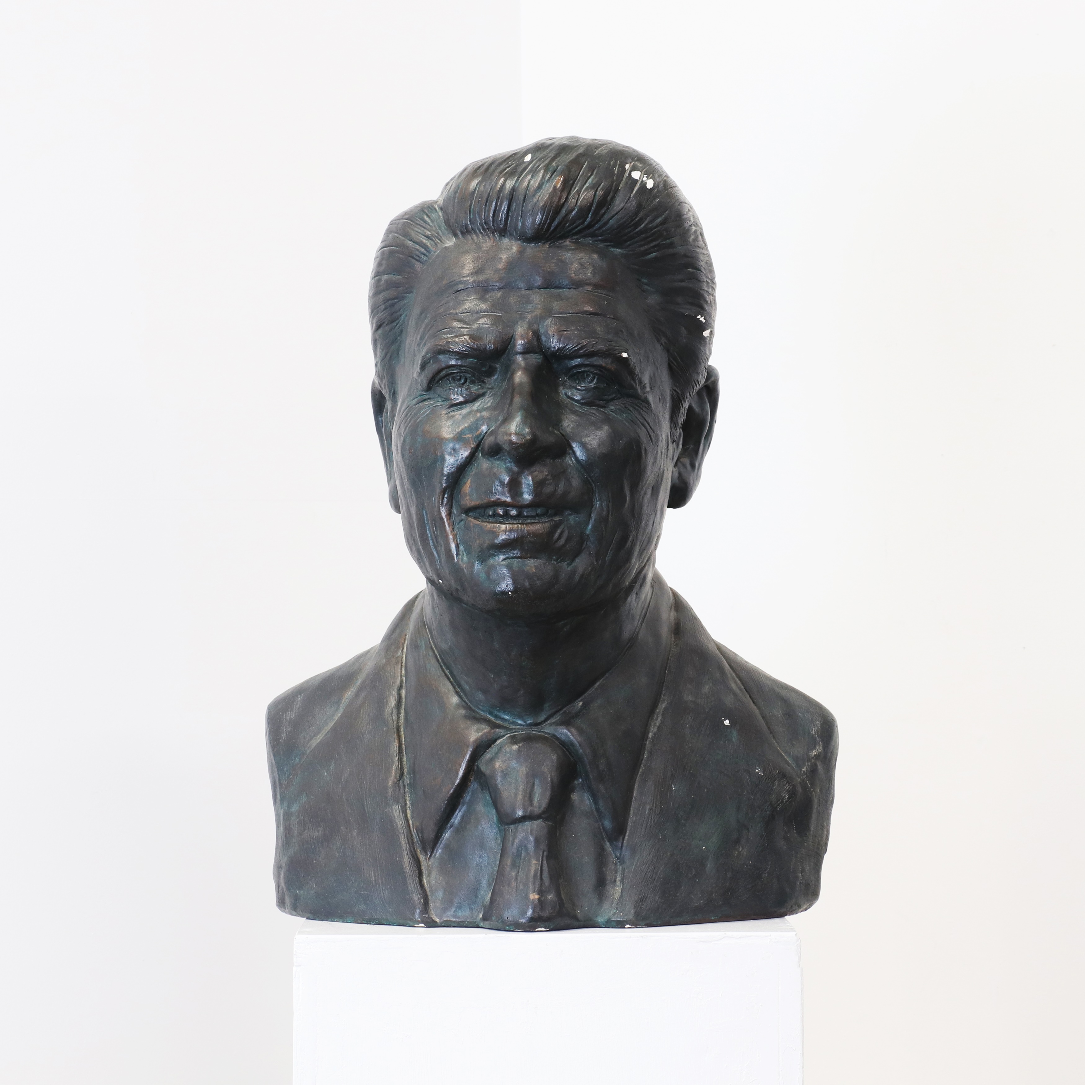 A large bronzed plaster bust of Ronald Reagan - £500-£700