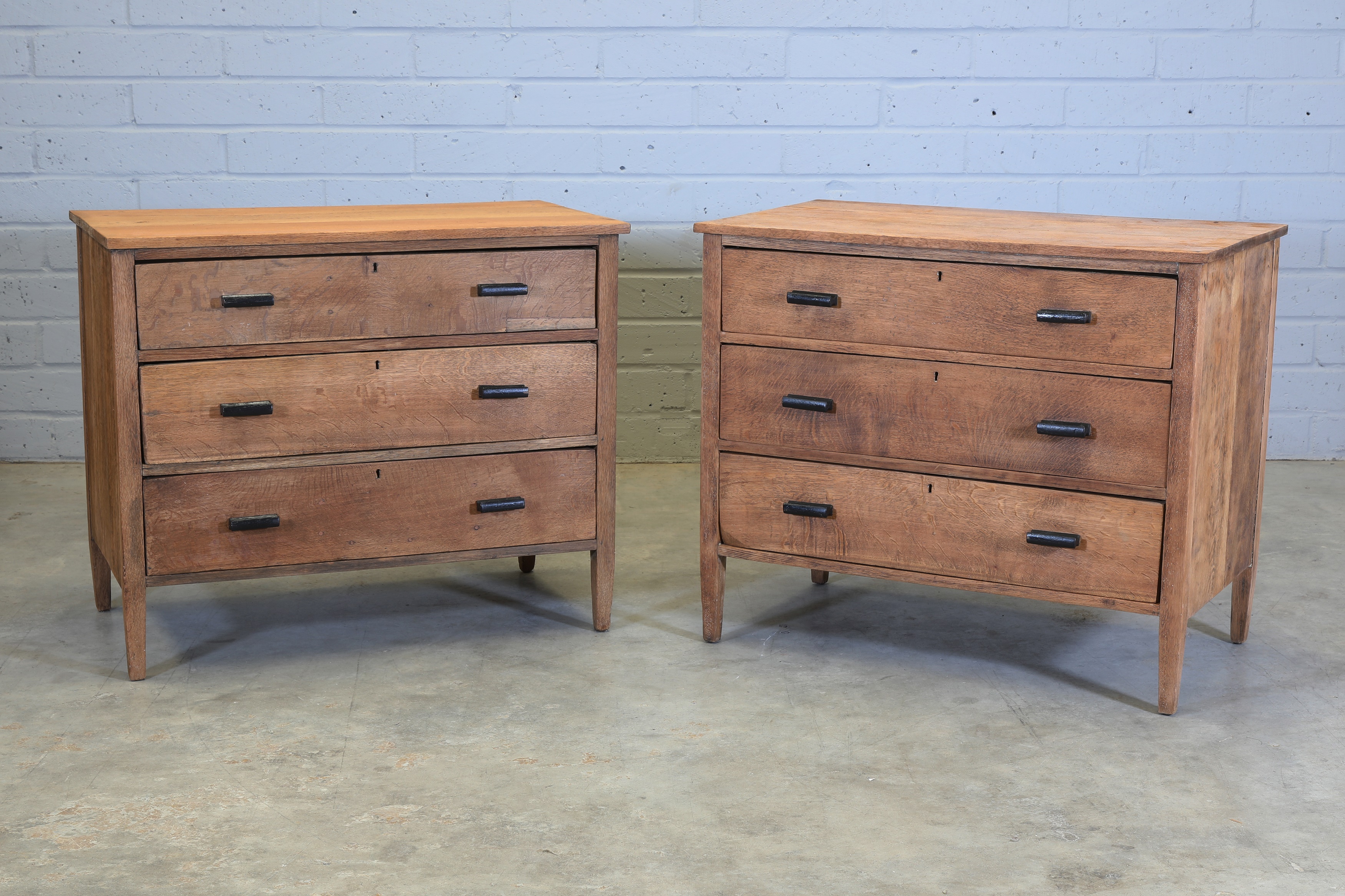 A pair of oak chest of drawers (sold for £365)