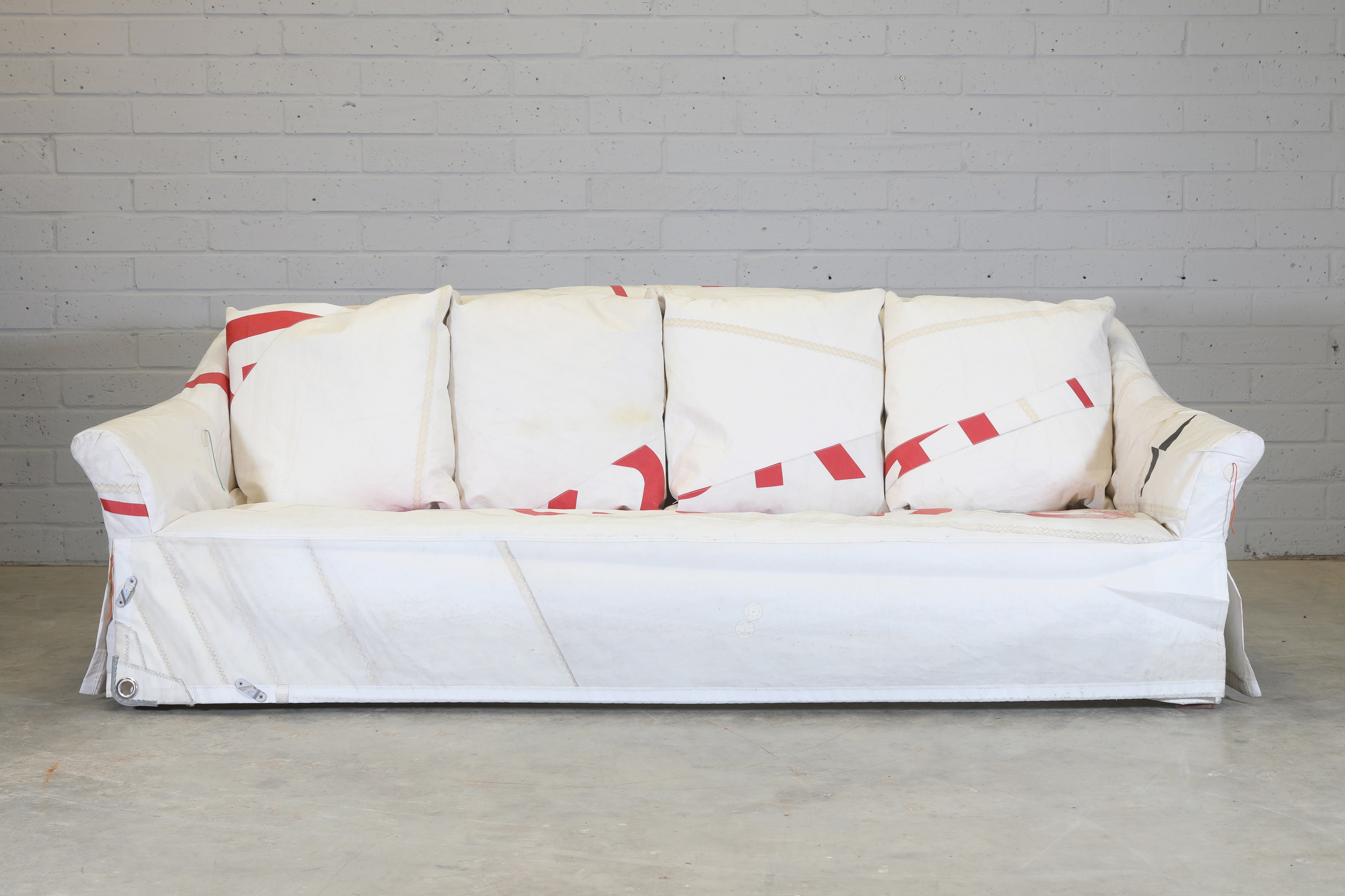 'For Sail', 2008, a unique 'Nikki' sofa upholstered in the reclaimed sail from a 470 regatta sailing dinghy (£800-1,200)