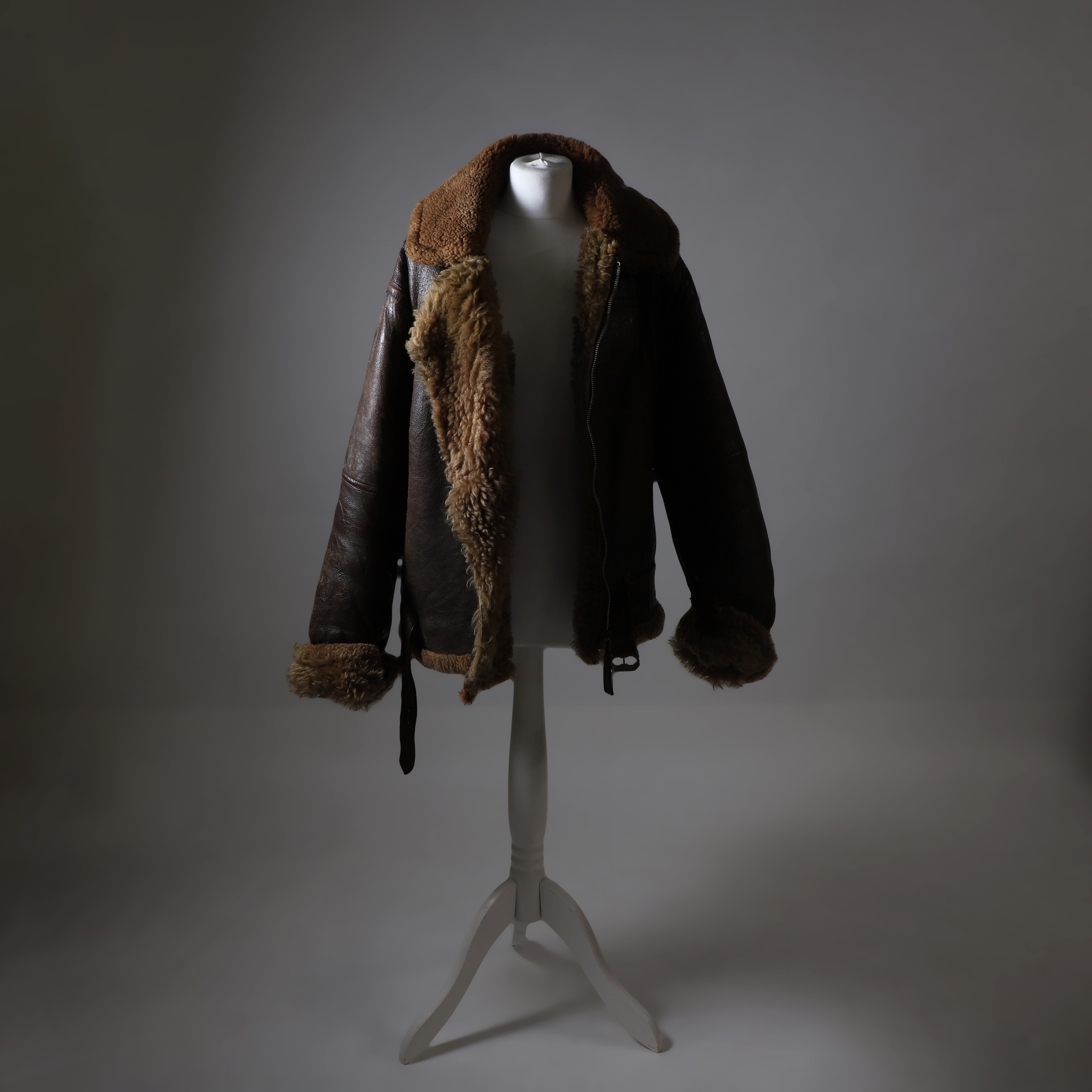 A WWII Irvin 1943 pattern sheep skin and fleece lined leather flying jacket (£400-600)