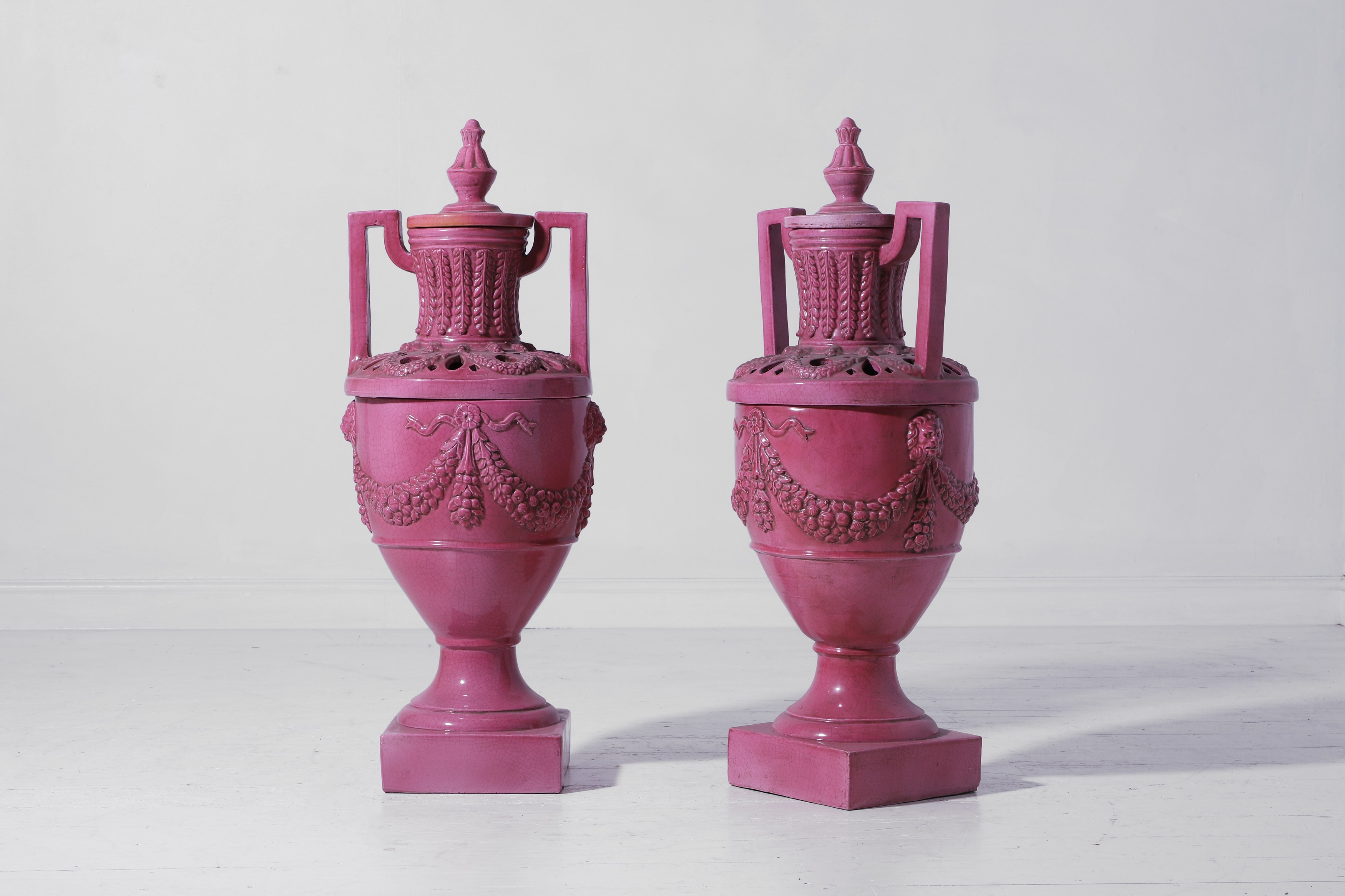 A pair of large neoclassical glazed stoneware urns