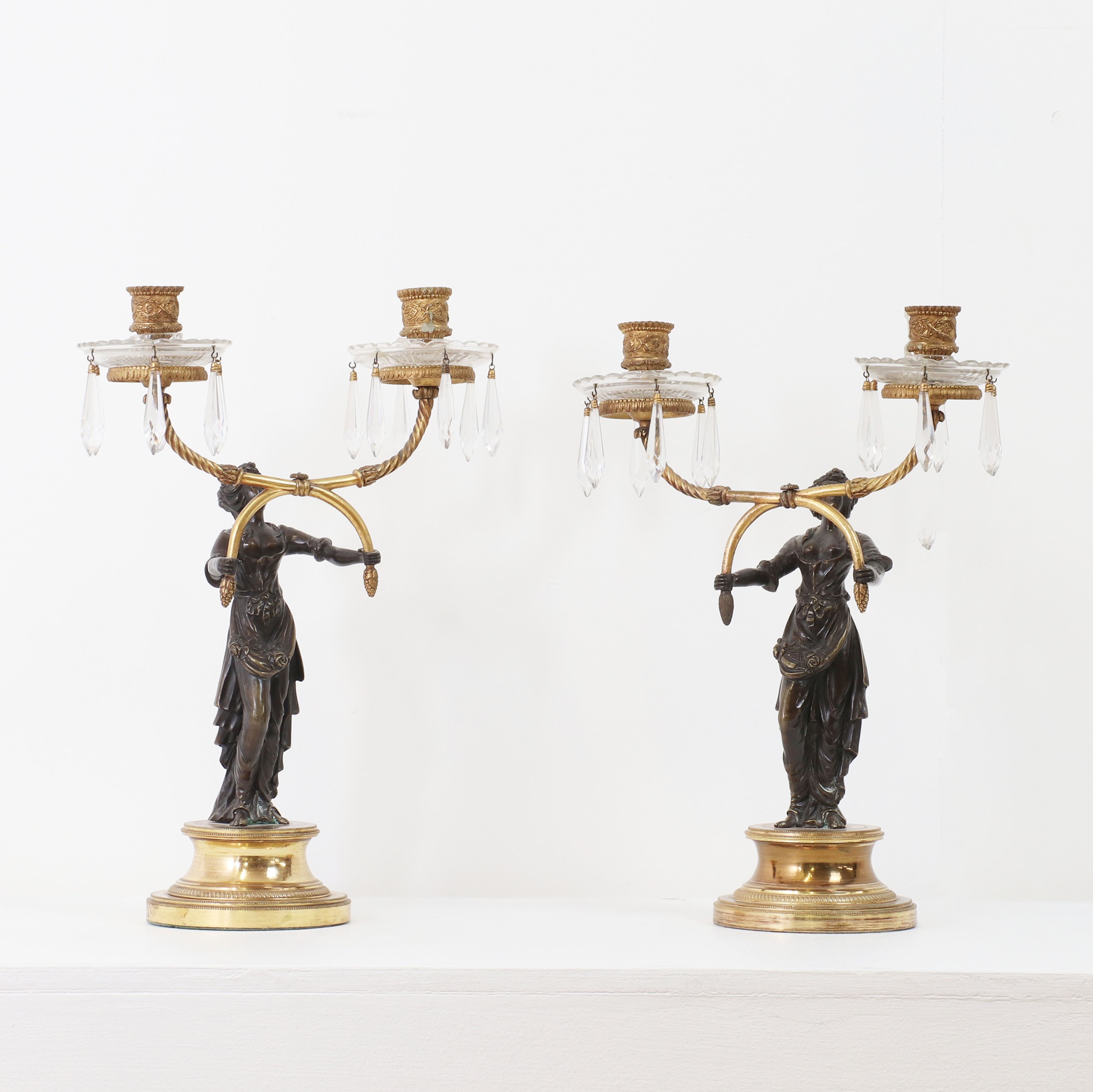A pair of Empire-style gilt and patinated bronze candelabra, second half of the 19th century, French