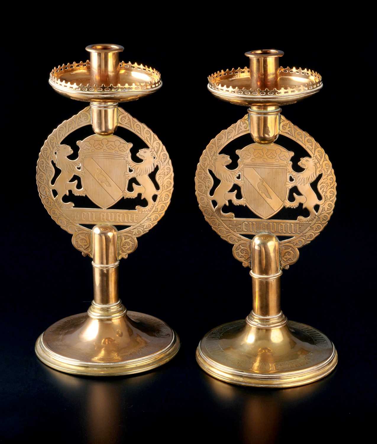 Lot 567 - A pair of gilt brass candlesticks