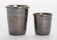 Lot 179 - Two novelty silver tot measures