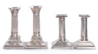 Lot 192 - A pair of Victorian silver dwarf candlesticks
