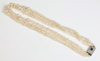 Lot 334 - A three row graduated natural pearl necklace