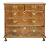 Lot 443 - A walnut veneered and oak chest of drawers