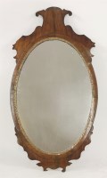 Lot 447 - A Georgian mahogany fret work wall mirror