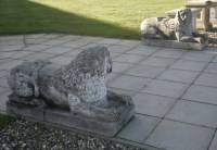 Lot 475 - A pair of Venetian-style composition recumbent stone lions