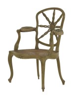 Lot 378 - An Heppelwhite-style wheel back elbow chair