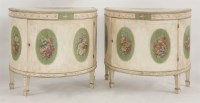 Lot 491 - A pair of painted demilune cabinets