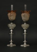 Lot 336 - A SINGLE OWNER COLLECTION OF OIL LAMPS

A pair of Victorian silver-plated candlestick oil lamps