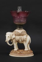 Lot 337 - A Victorian elephant oil lamp