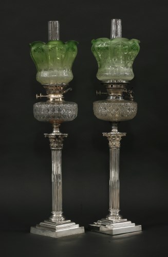 Lot 340 - A pair of Victorian silver-plated Corinthian column oil lamps