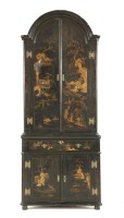 Lot 496 - A black lacquered standing corner cabinet