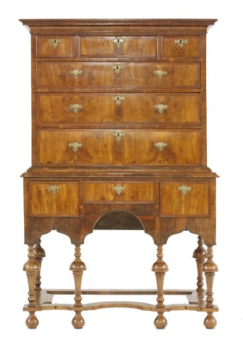 Lot 517 - A walnut and feather strung chest on stand
