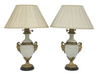 Lot 354 - A pair of celadon green porcelain and gilt metal mounted baluster lamps