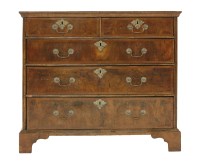 Lot 412 - A walnut and feather banded chest