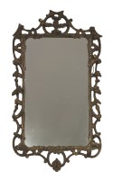 Lot 414 - A carved giltwood rococo mirror