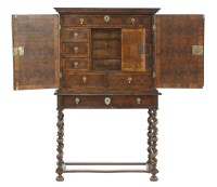 Lot 424 - A William & Mary oyster veneered cabinet on stand