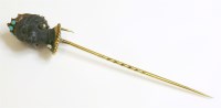 Lot 299 - An early Victorian gem set blackamoor stick pin