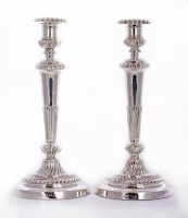 Lot 65 - A pair of George III silver candlesticks