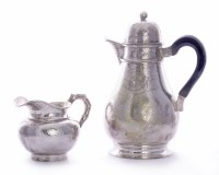 Lot 13 - A Chinese export silver coffee pot and milk jug