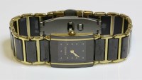 Lot 603 - A ladies' black ceramic and gold plated stainless steel Rado Diastar Quartz bracelet watch