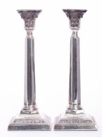 Lot 135 - A pair of silver candlesticks