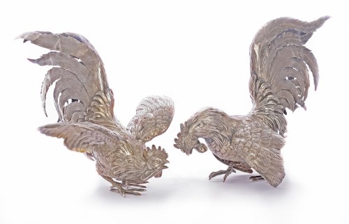 Lot 153 - A pair of silver models of cockerels