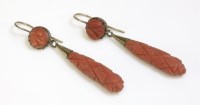 Lot 297 - A pair of gold carved coral drop earrings