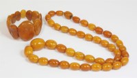 Lot 322 - A single row graduated amber bead necklace