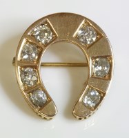Lot 345 - A late Victorian diamond set horseshoe brooch