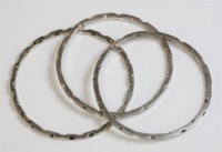 Lot 56 - A set of three sterling silver slave bangles