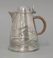 Lot 185 - A Tudric pewter lidded jug
