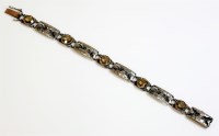 Lot 7 - An and Arts and Crafts sterling silver smokey quartz bracelet