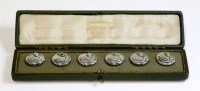 Lot 1 - A cased set of sterling silver Arts and Crafts Cymric buttons