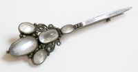 Lot 18 - A silver Arts and Crafts moonstone brooch