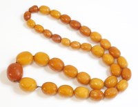Lot 321 - A single row graduated butterscotch amber bead necklace