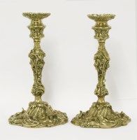 Lot 4 - A pair of rococo bronze candlesticks