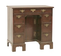 Lot 41 - A small George III mahogany kneehole desk