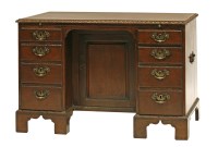 Lot 49 - A George III mahogany kneehole desk