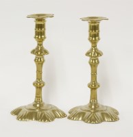 Lot 111 - A pair of brass candlesticks