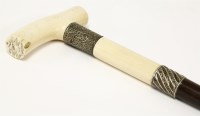 Lot 143 - A heavy ivory and ebony walking stick