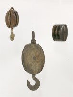 Lot 152 - Three antique elm pulley blocks