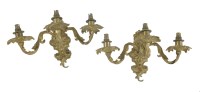 Lot 153 - A pair of gilt bronze three-branch wall lights