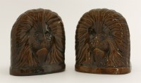 Lot 163 - A pair of treacle-glazed furniture feet