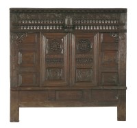 Lot 336 - A Breton oak panelled bed front