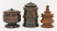 Lot 83 - Three turned treen boxes and covers