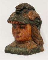 Lot 1179 - A polychrome and carved head of an Amazon warrior